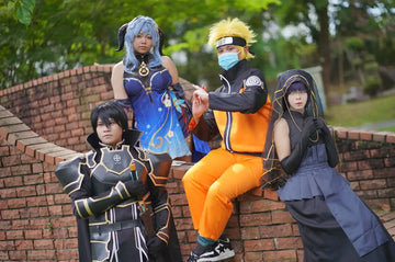 Cosplayers posing on a brick wall.