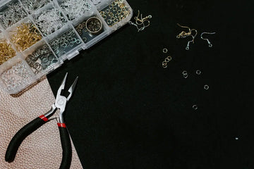 black and red handled pliers and beads organizer