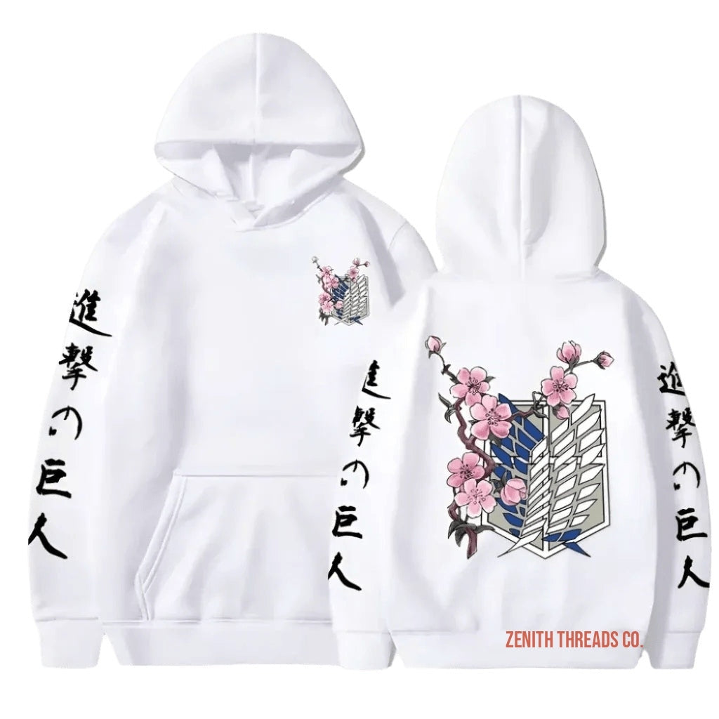 White hoodie with Japanese text and cherry blossom design featuring the Survey Corps wings emblem from Attack on Titan.