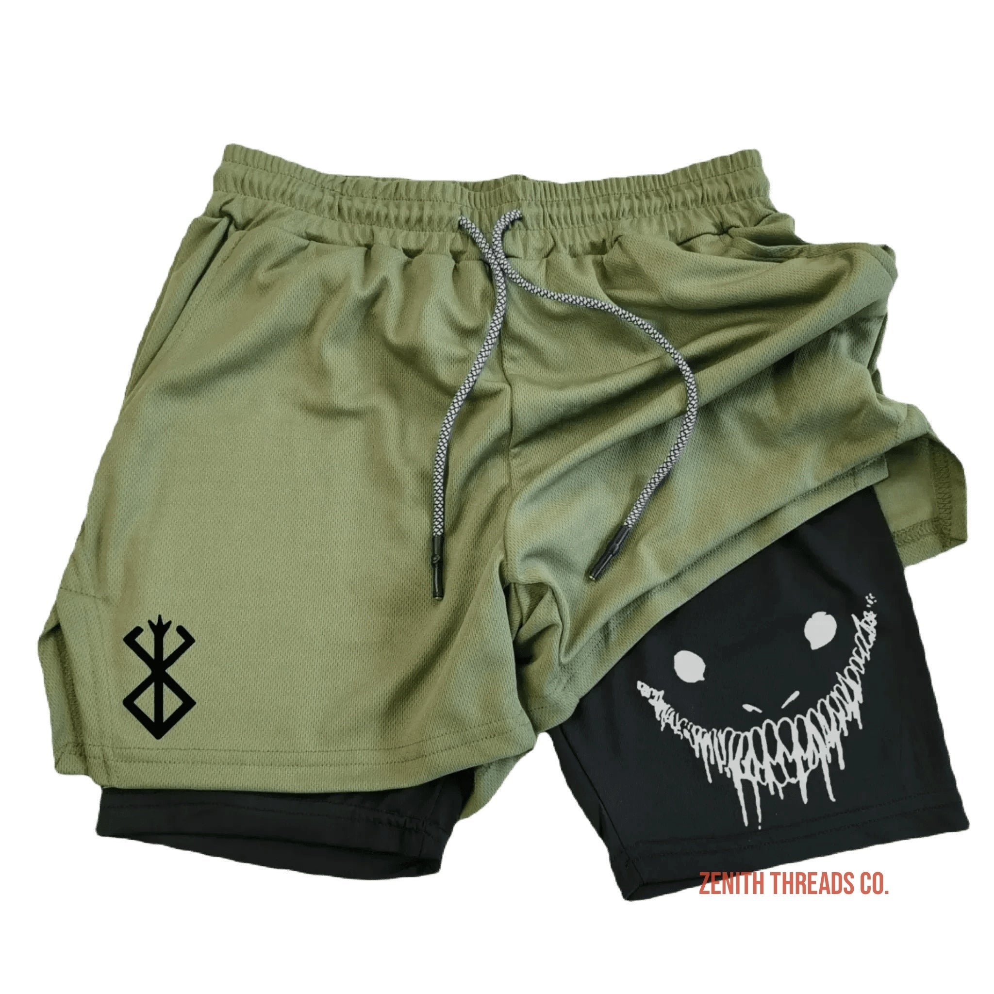 Olive green athletic shorts with built-in black compression layer and a smiling face design.