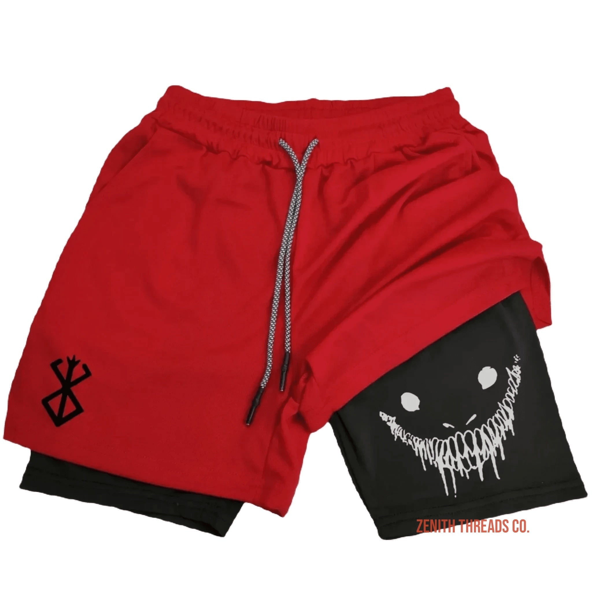 Red athletic shorts with a black layer underneath featuring a creepy smiling face design.