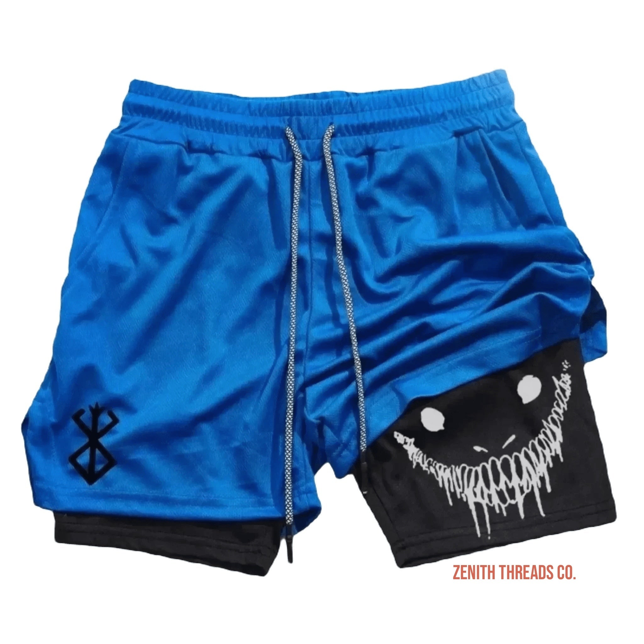 Blue and black athletic shorts with a smiling monster face design on the side.