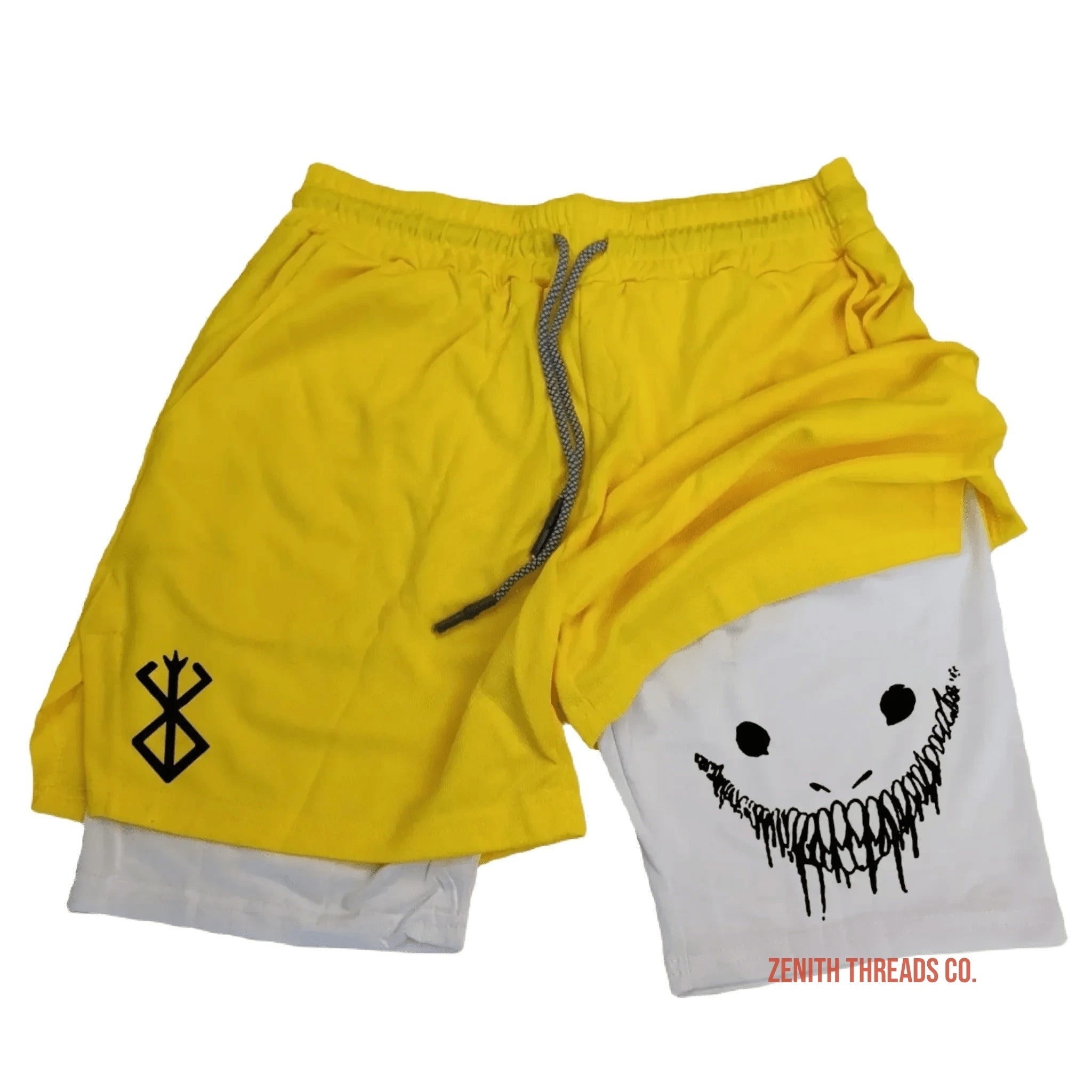 Yellow athletic shorts with white compression layer and a creepy smiley face design.