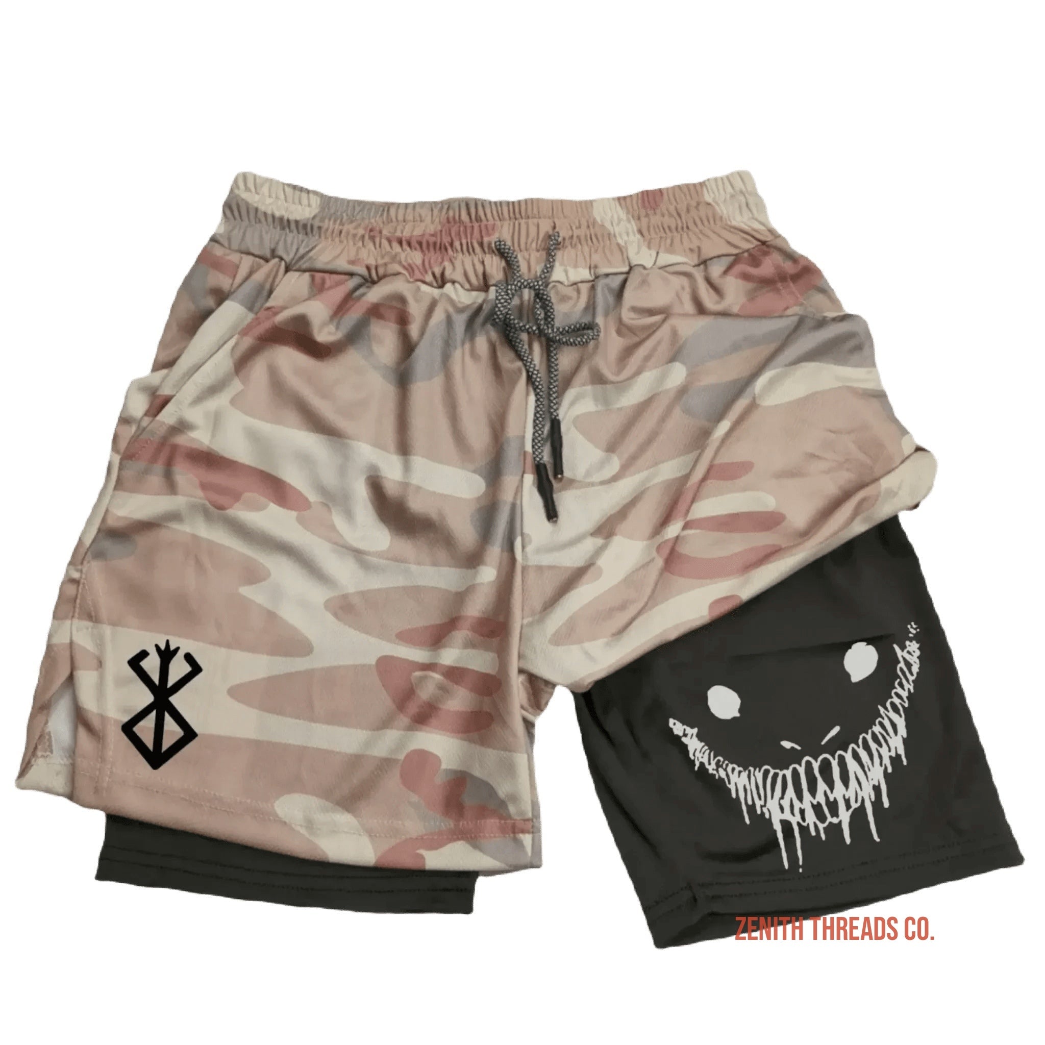 Athletic shorts with a camouflage pattern and a black underlayer featuring a smiling face design.