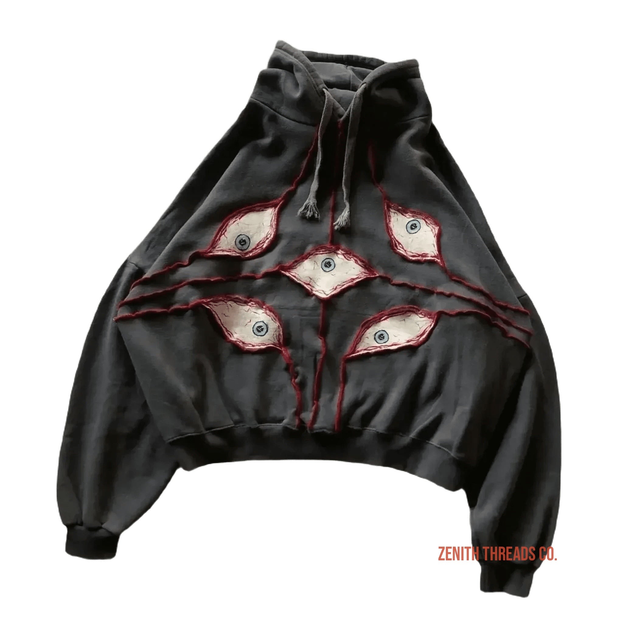 Black hoodie with red and white eye designs embroidered on the front.