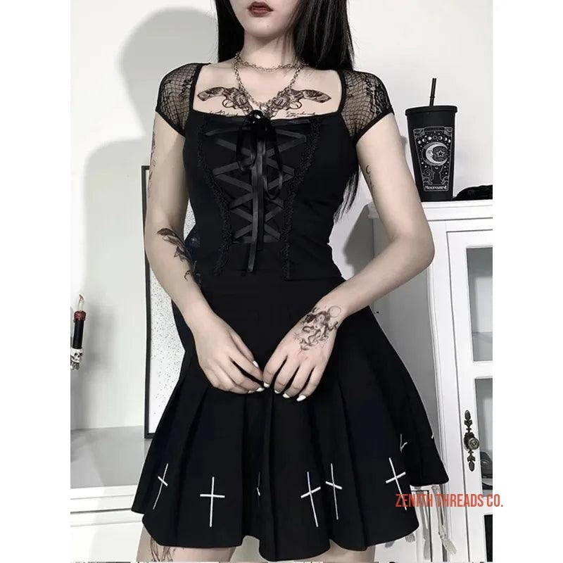 Gothic black dress with mesh sleeves and cross designs on the skirt.