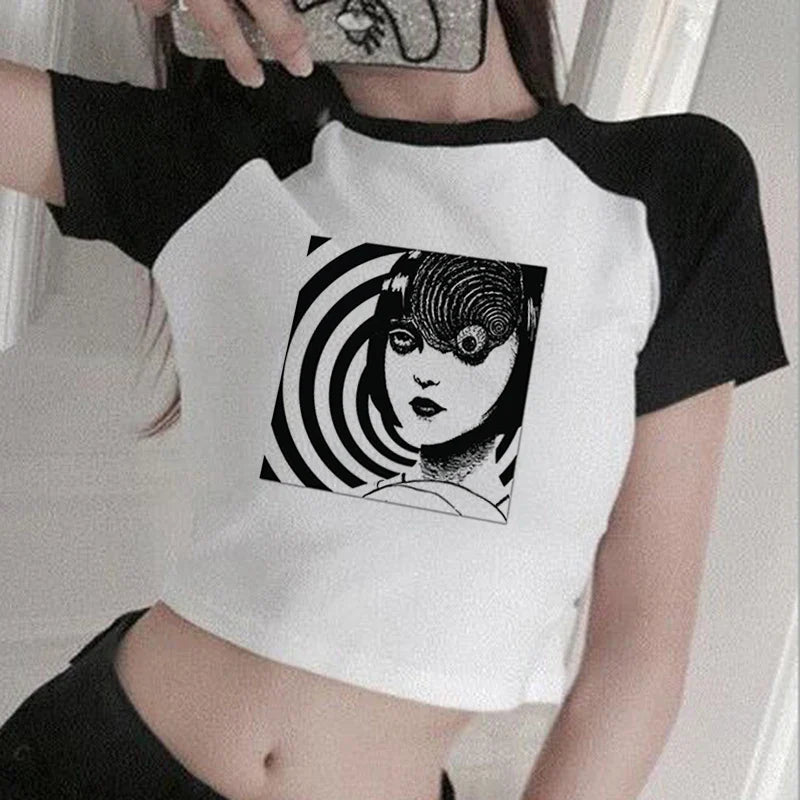 Cropped raglan t-shirt featuring a black and white spiral artwork with an anime-style face design.