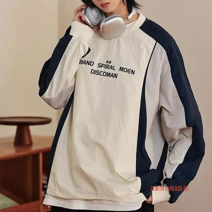 White and navy blue pullover jacket with ’BAND SPIRAL MOEN DISCOMAN’ text printed on the front.