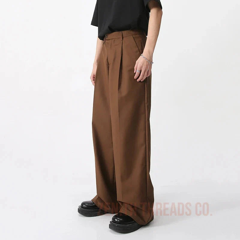 Wide-leg brown dress pants with pleats.