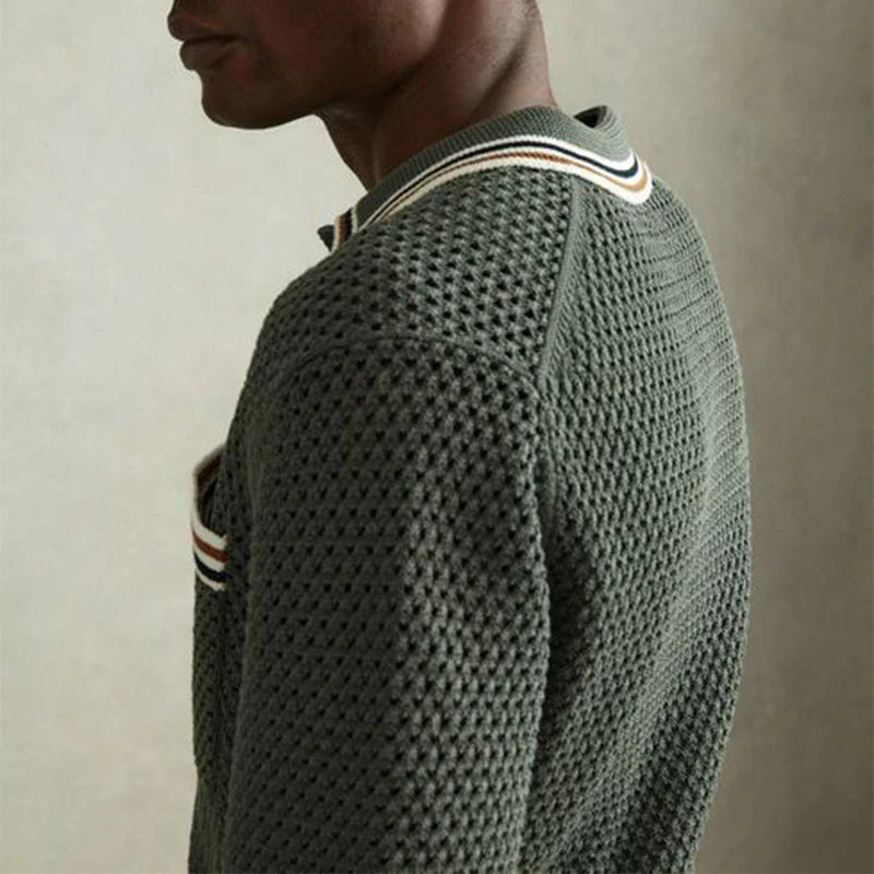 Olive green knitted sweater with a textured honeycomb pattern and striped collar detail.