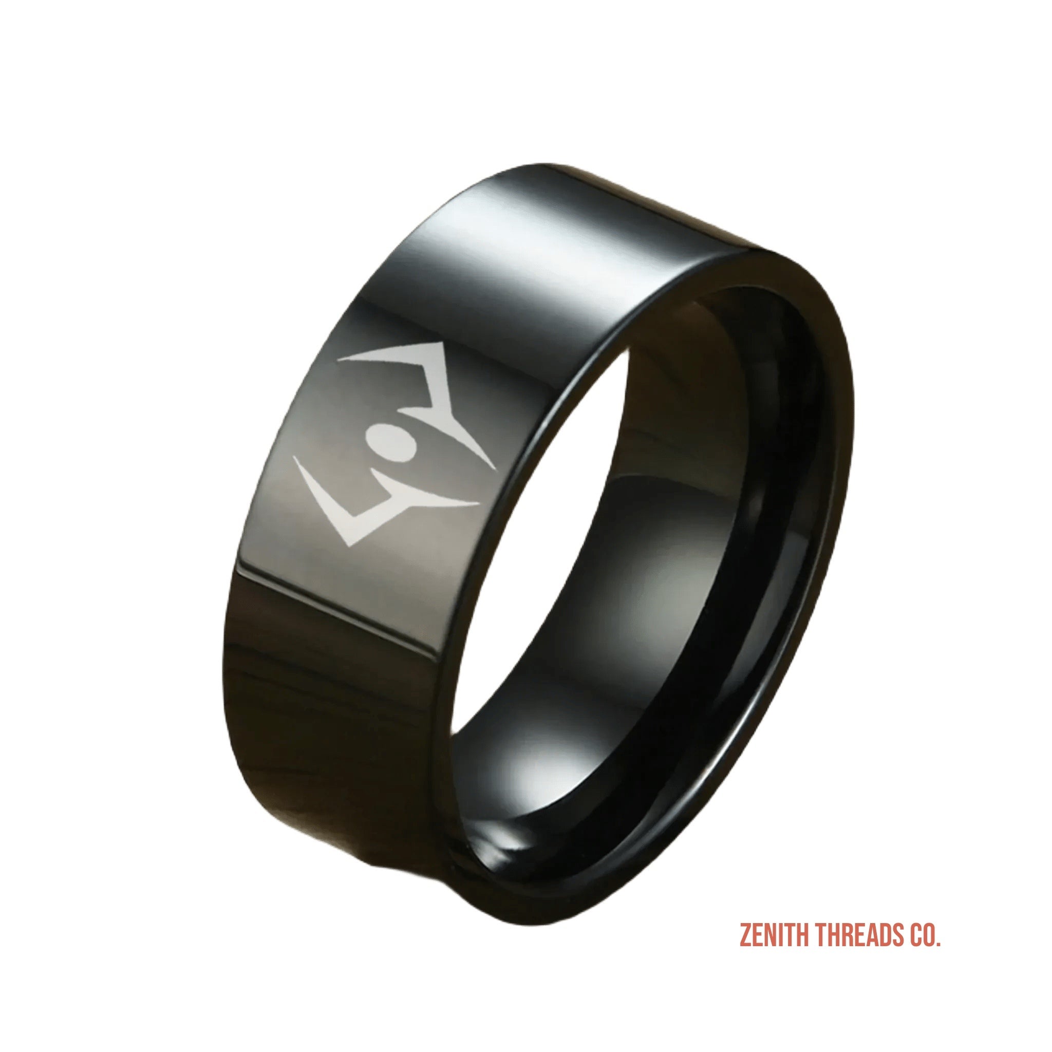 Black tungsten ring with an engraved geometric symbol.