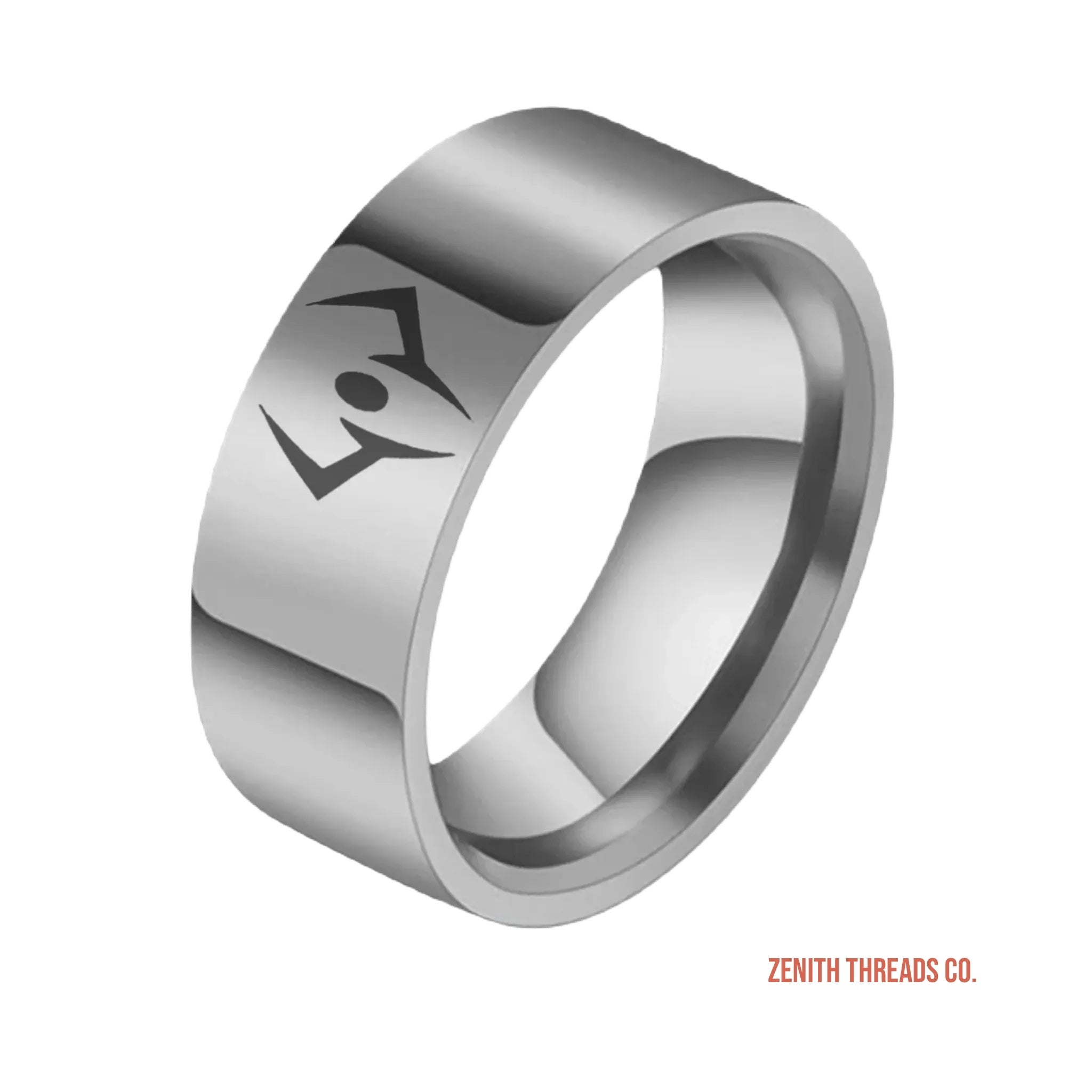 Silver metallic ring with an engraved geometric design.