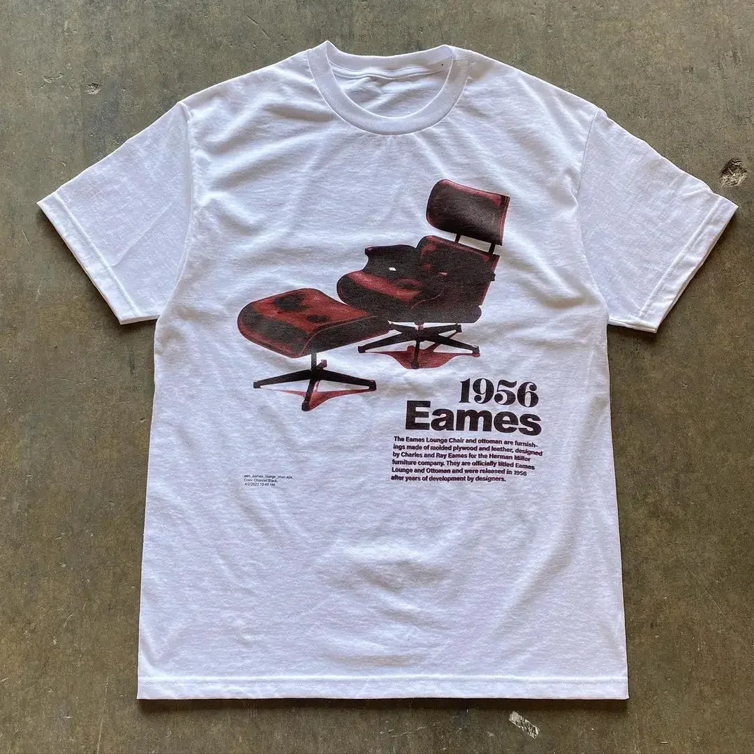 White t-shirt featuring a graphic print of a 1956 Eames lounge chair design.