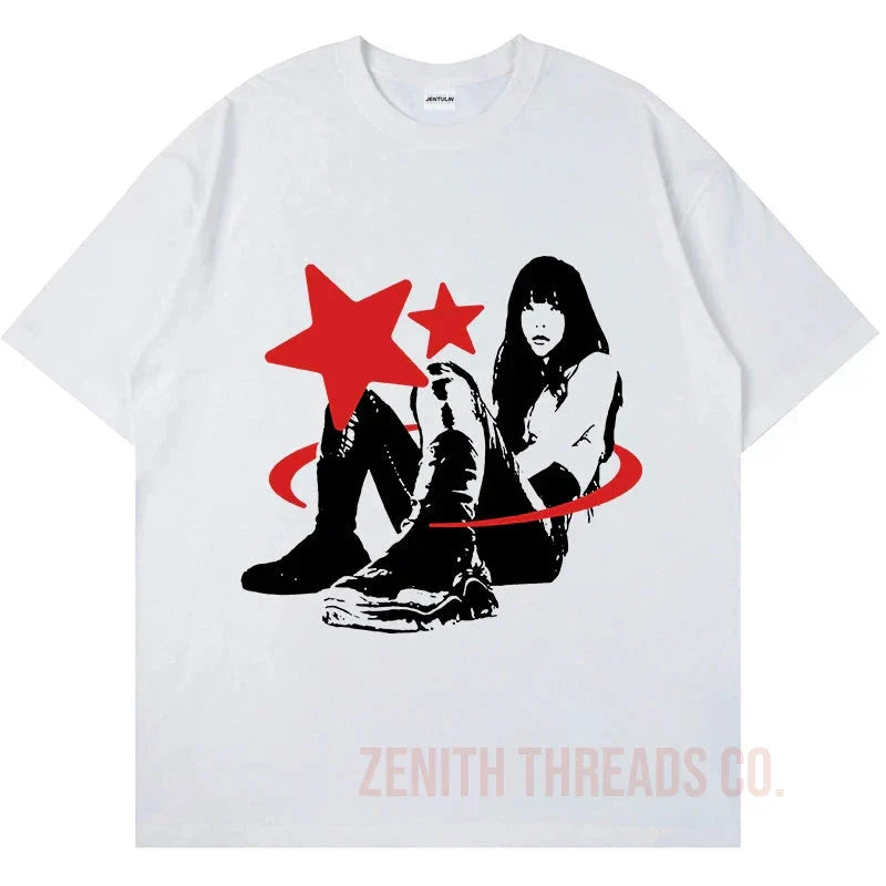 White t-shirt featuring a black and red graphic design with stars and a figure wearing boots.