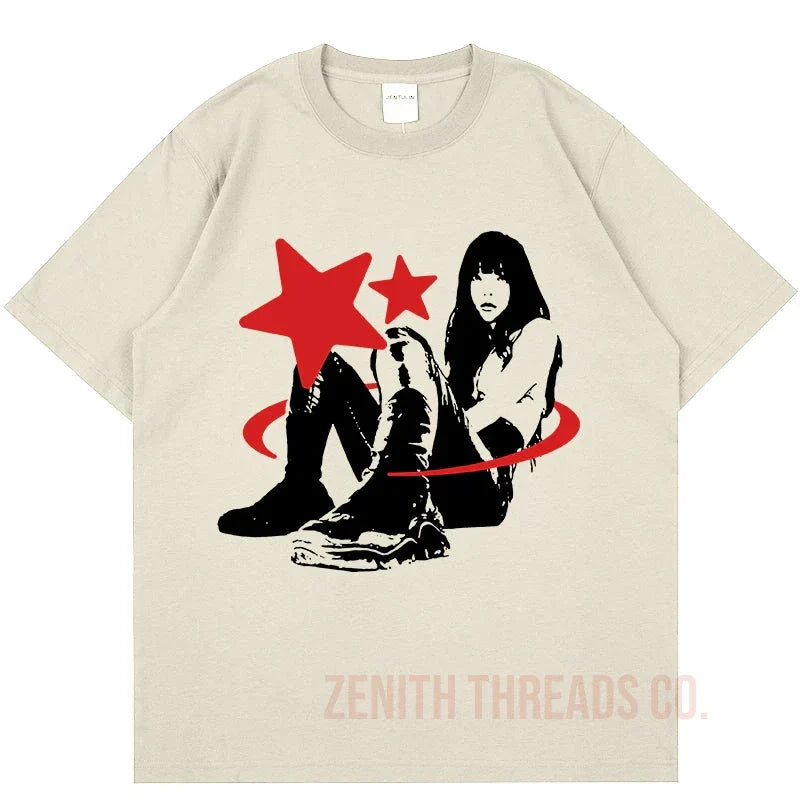 Beige t-shirt featuring a black and red graphic design with stars and a silhouetted figure.