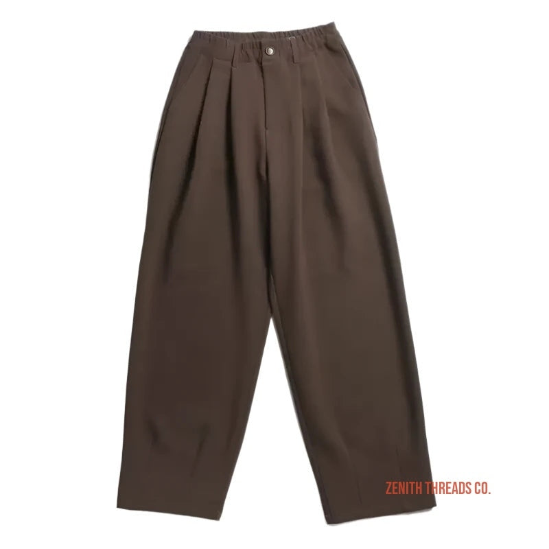 Brown pleated trousers with a wide-leg silhouette.