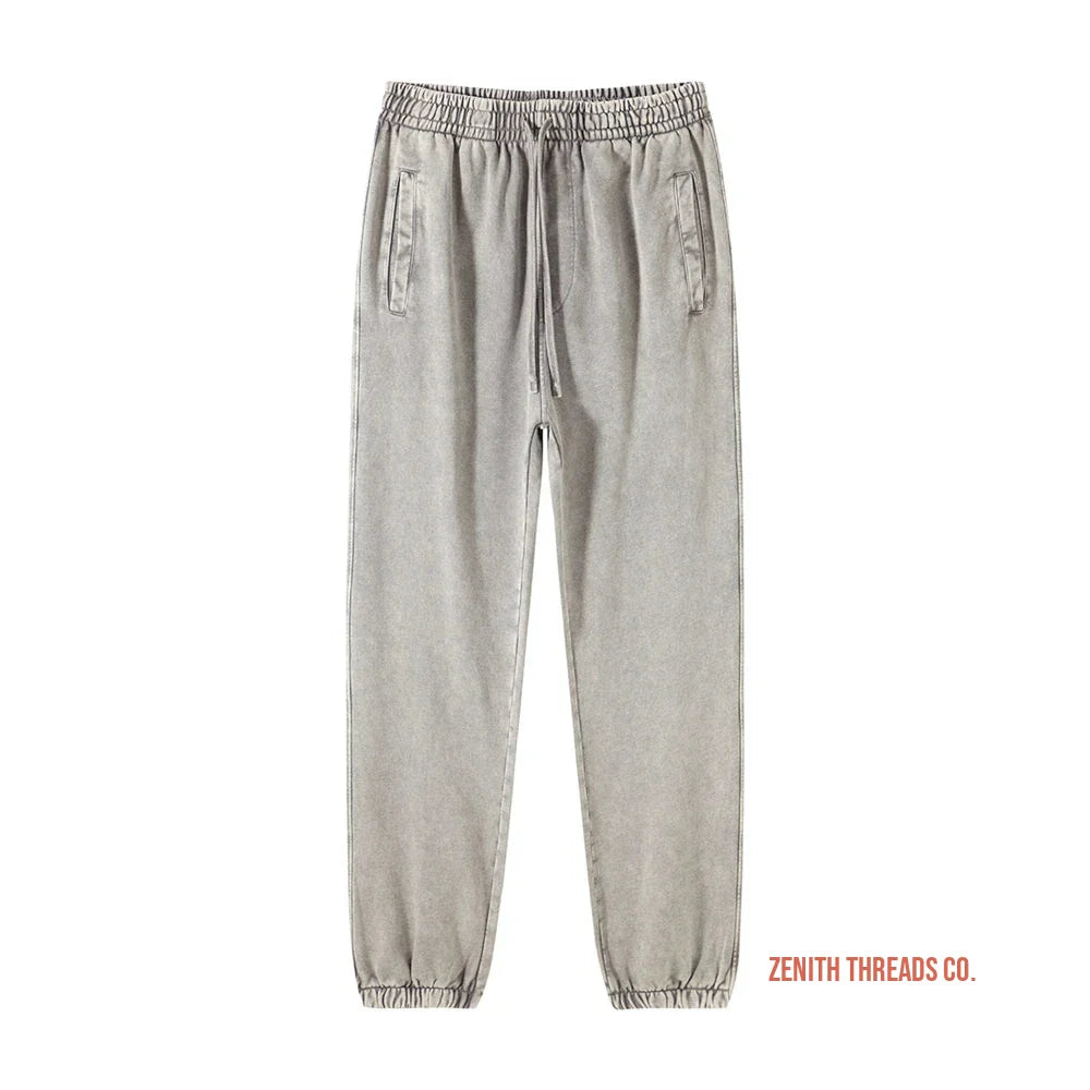 Light gray jogger-style sweatpants with elastic cuffs and drawstring waist.