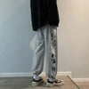 Gray piece pants featuring manga panels from the Anime Inspired One Piece Graphic Pants Collection