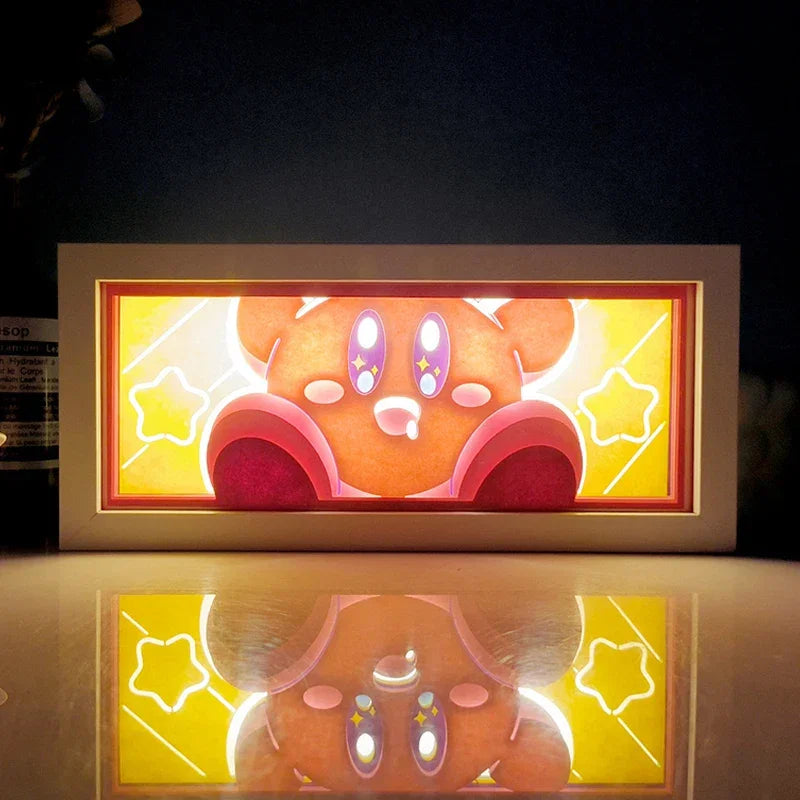 Illuminated Kirby artwork in an Illumiscene anime shadow light box enhances paper-cut shadow art