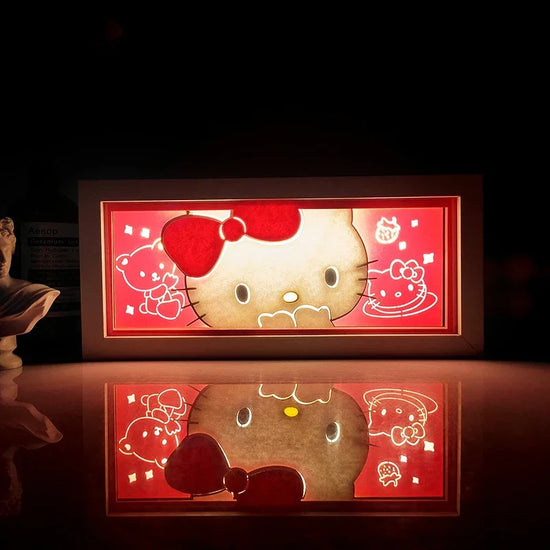 Illuminated Hello Kitty artwork from Illumiscene anime shadow light box in paper-cut style