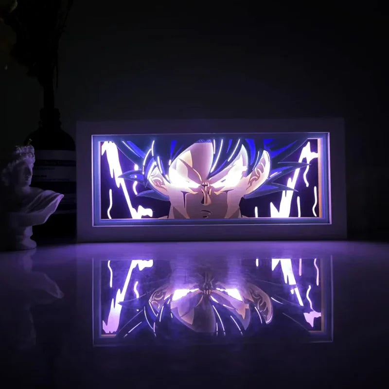 Illuminated Goku artwork in Illumiscene anime shadow light box showcasing paper-cut shadow art