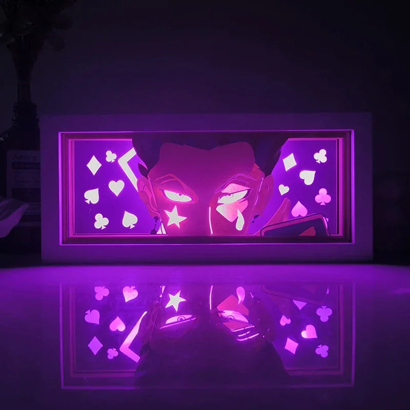 Illumiscene anime shadow light box showcasing illuminated Hisoka paper-cut shadow art