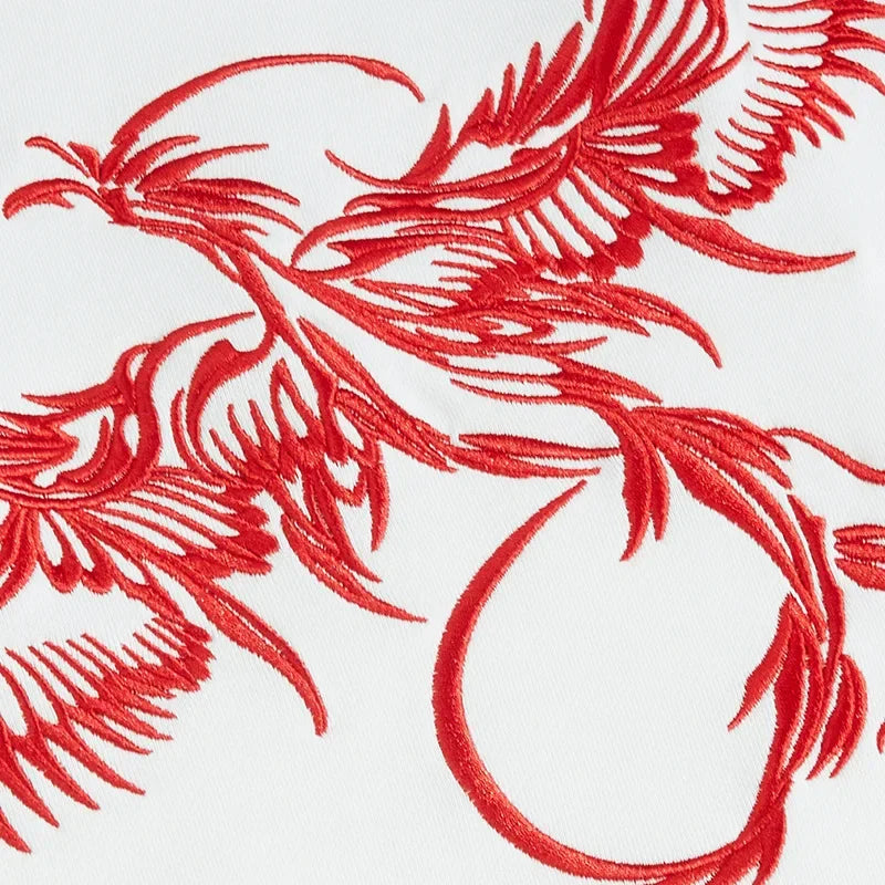 Red embroidered phoenix design on Anime graphic tee for men women in streetwear style