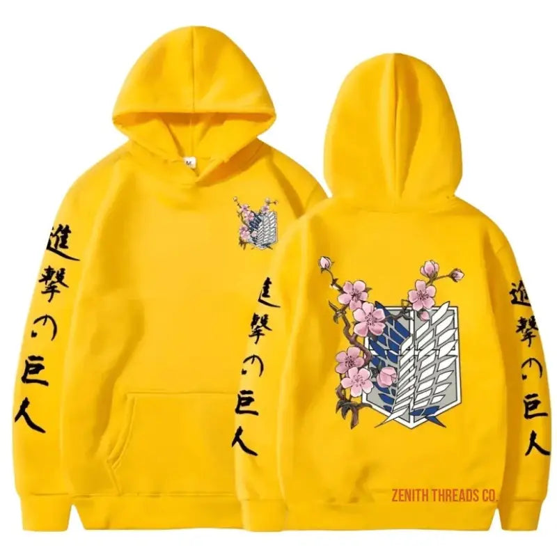 Yellow hoodie with Attack on Titan anime design featuring Japanese text and the Survey Corps wings logo with cherry blossoms.