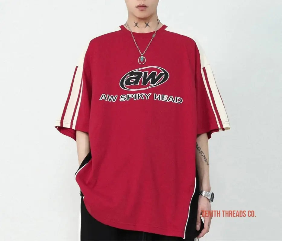 Red oversized t-shirt with ’AW’ branding and white stripe accents on the sleeves.