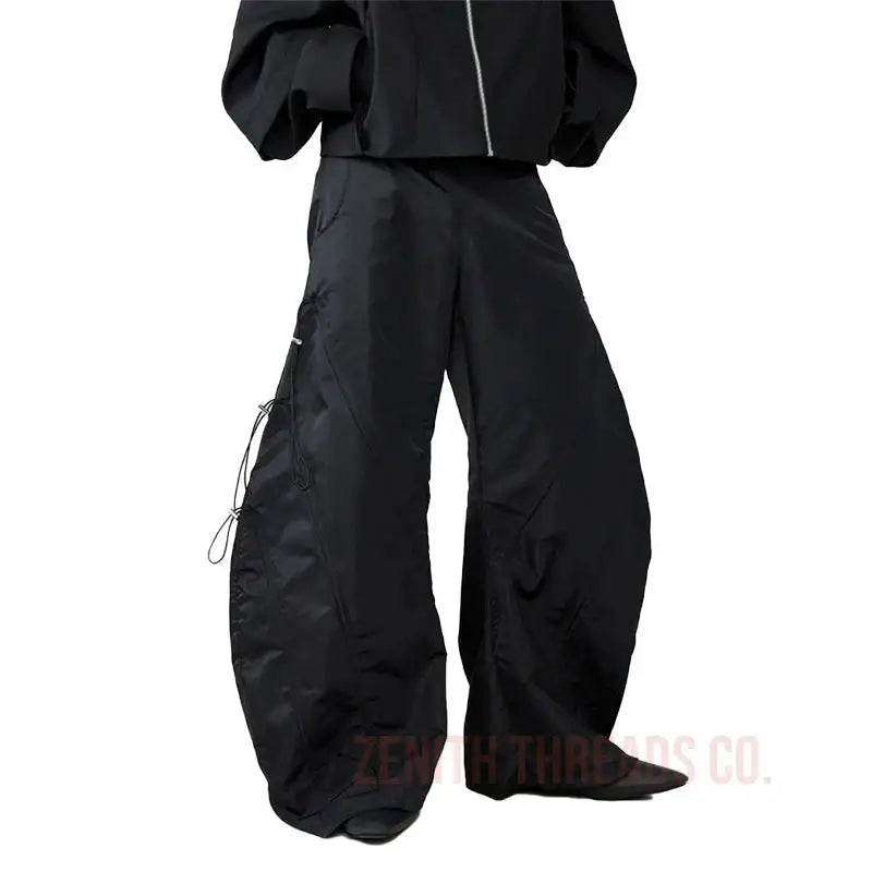 Black wide-leg cargo pants with drawstring details.