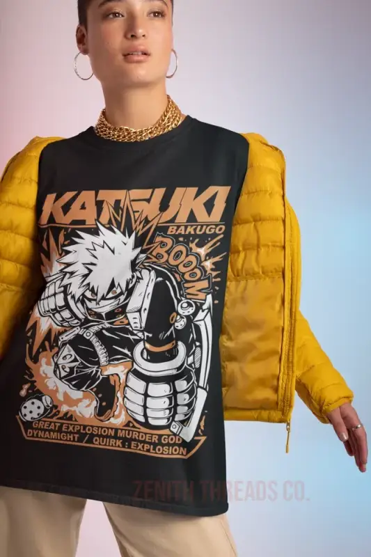 Black graphic t-shirt featuring a manga-style ’Katsuki’ design paired with a yellow puffer sleeve jacket.