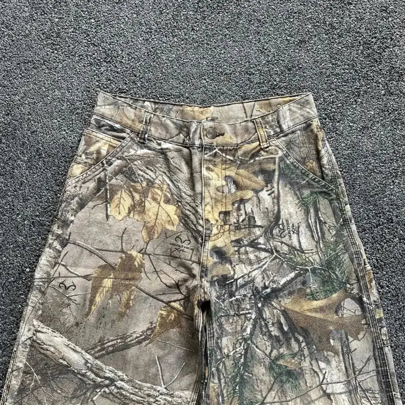 Camouflage hunting pants with a woodland pattern.