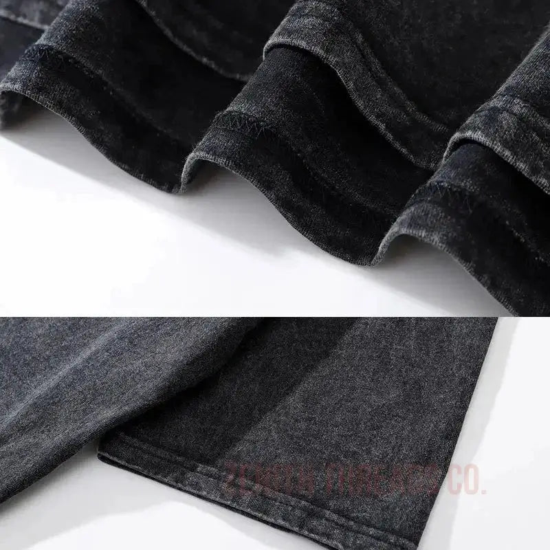 Black velvet fabric with pleated folds and texture.