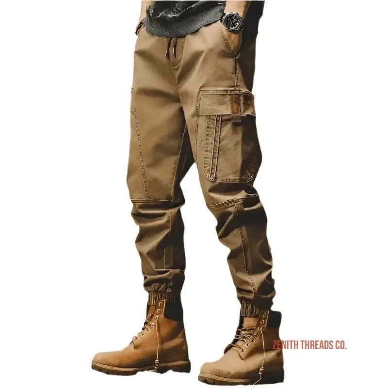 Khaki cargo pants with multiple pockets paired with brown leather work boots.