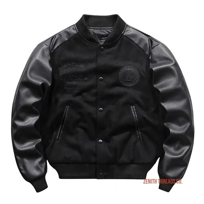 Black varsity jacket with leather sleeves and snap buttons.