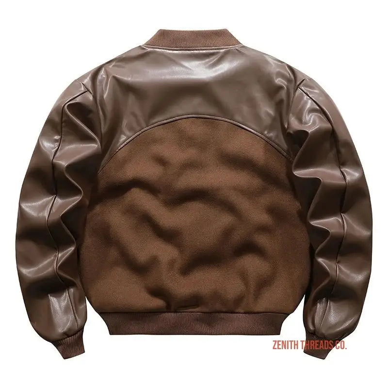 Brown leather bomber jacket with contrasting fabric panels on the back.