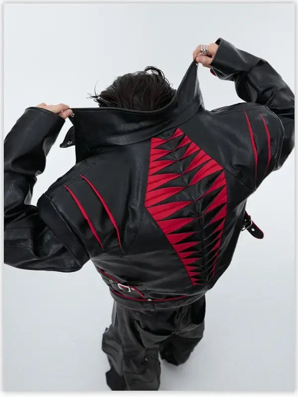 Black jacket with red spine-like design cut into the back.