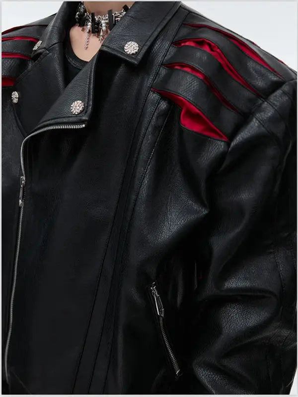 Black leather motorcycle jacket with red accents and silver studs.