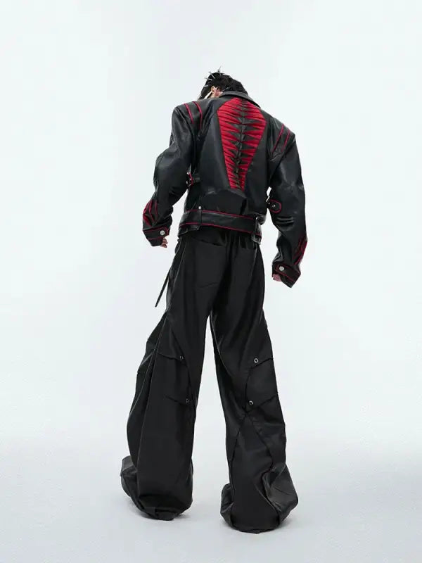 Black and red futuristic combat suit with wide-leg pants and armored details.