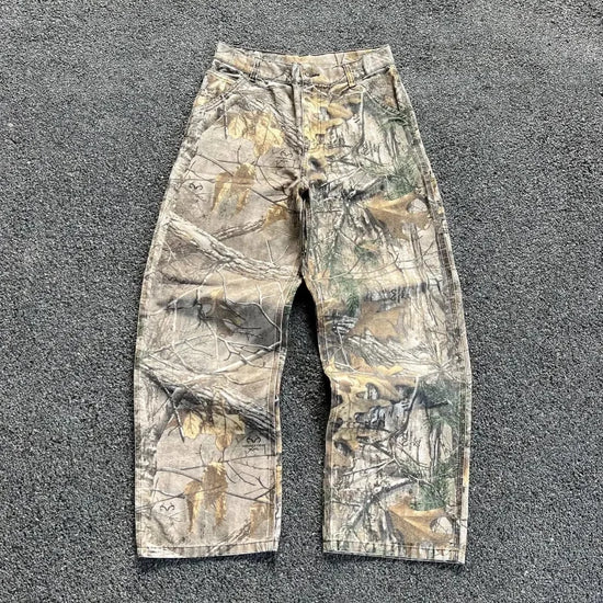 Camouflage-patterned work pants exemplifying urban camo print baggy pants in streetwear fashion