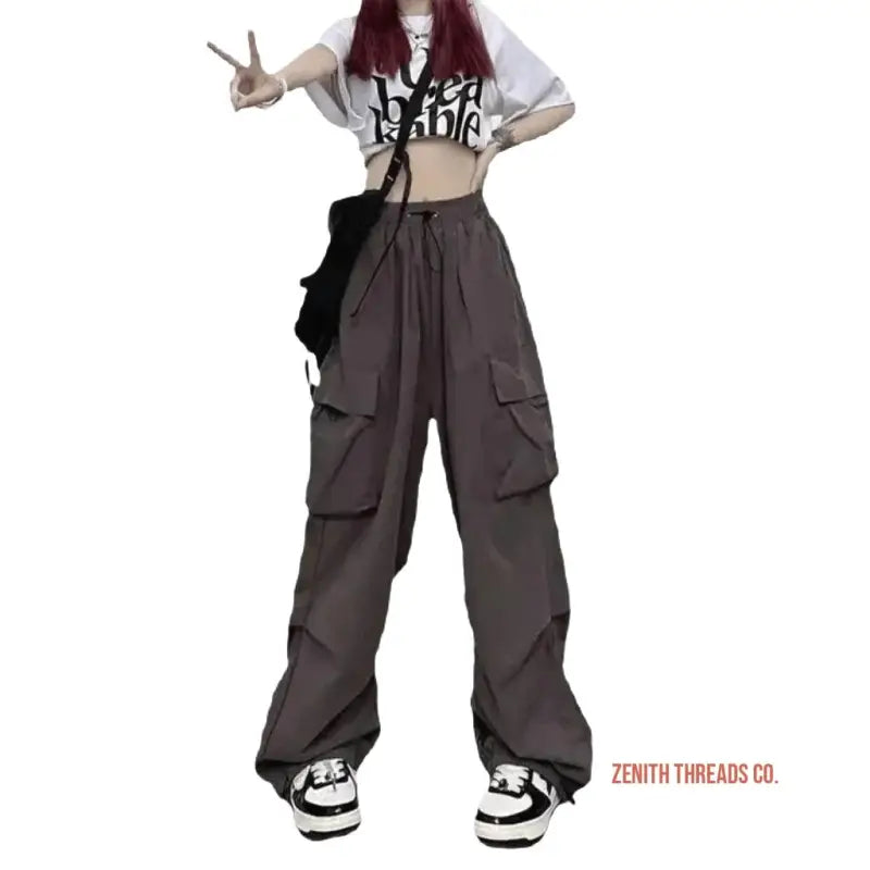 Wide-leg cargo pants in dark gray with multiple side pockets.