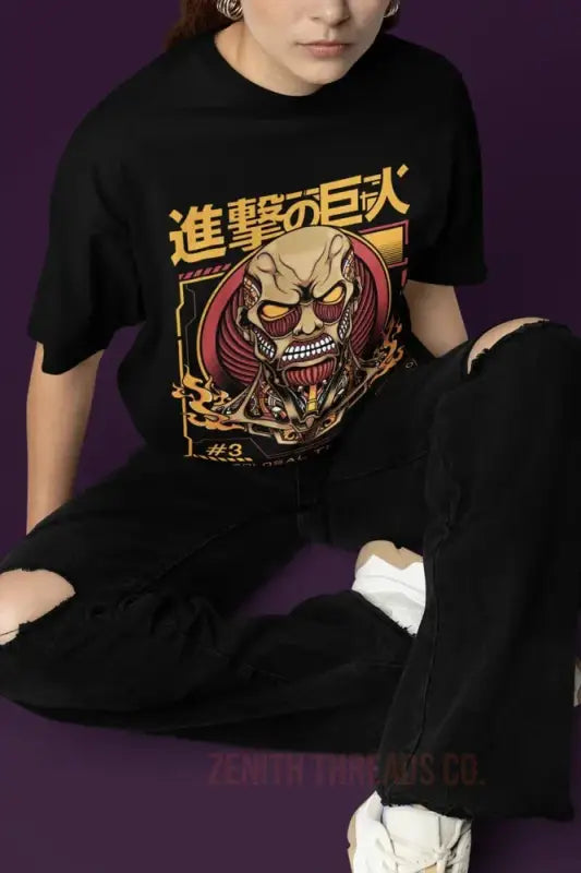 Black t-shirt featuring Attack on Titan anime artwork with Japanese text and a Titan character design.