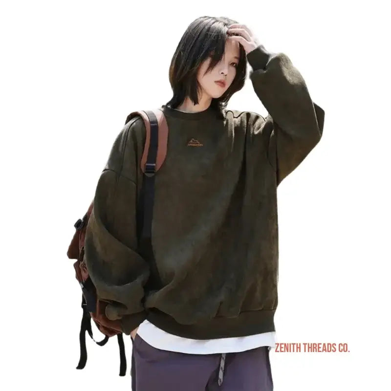 Dark olive green oversized sweatshirt with a white underlayer.