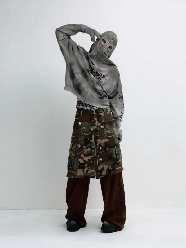 Person in balaclava and camouflage shorts wearing Destructive Stained Face Mask Hoodie