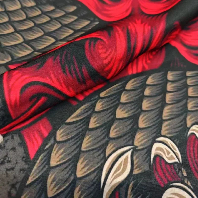 Wrinkled fabric showcases red and gray pattern on Dragon Demon anime kimono traditional clothing