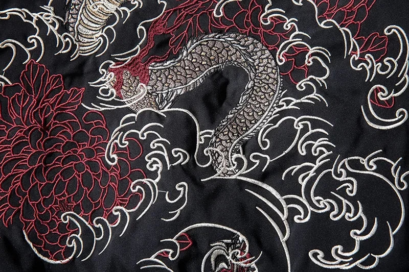 Embroidered dragon and floral design on black fabric for Japanese streetwear bomber jacket