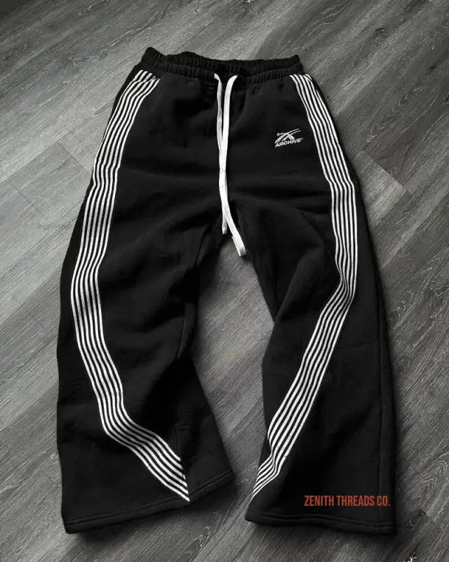 Black athletic sweatpants with white striped details along the sides.