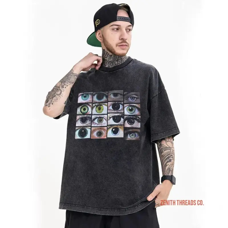 Black t-shirt featuring a grid of colorful eye photographs.