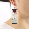 Rectangular Demon Slayer Hanafuda earrings with sun design for anime fans