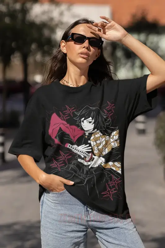 Black t-shirt featuring an anime-style character design with pink and gold accents.